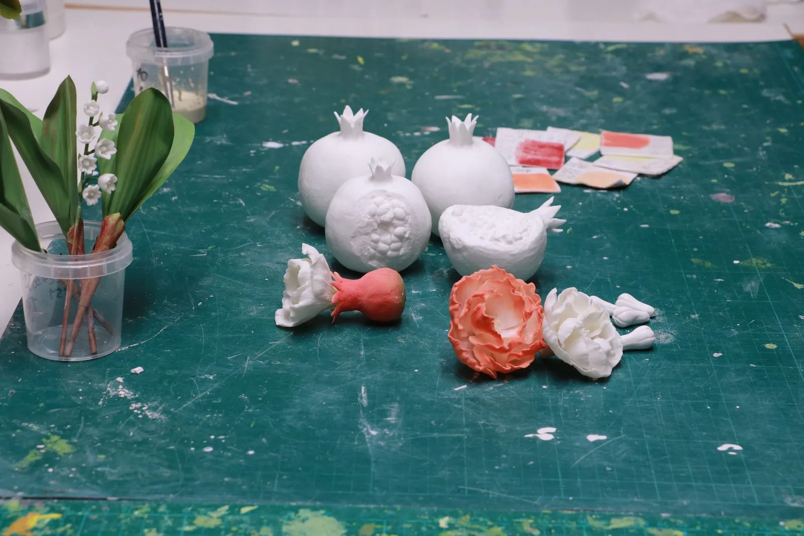 Working in porcelain: pomegranates and blossoms on the bench