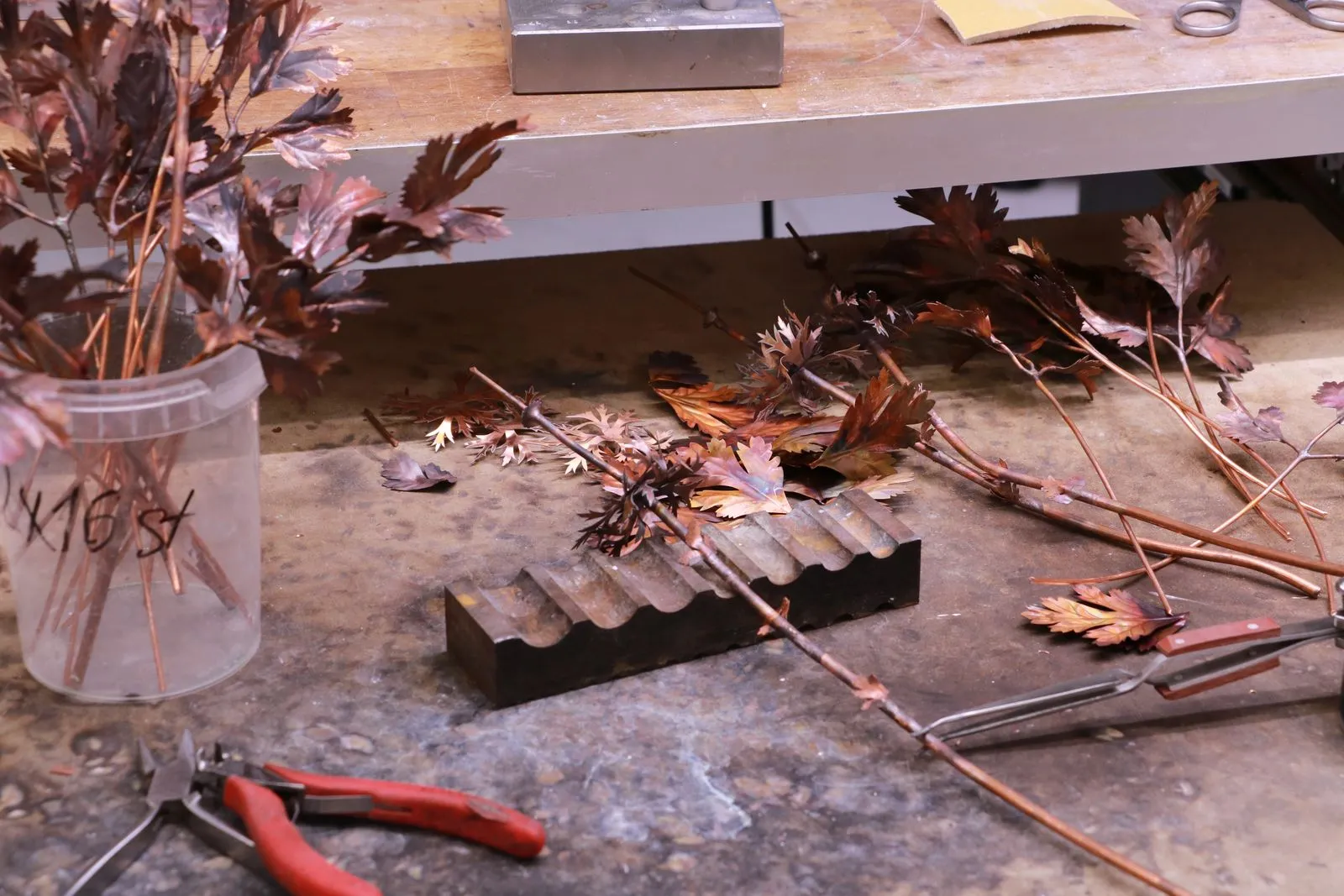 Working in copper: leaves and branches at the workbench