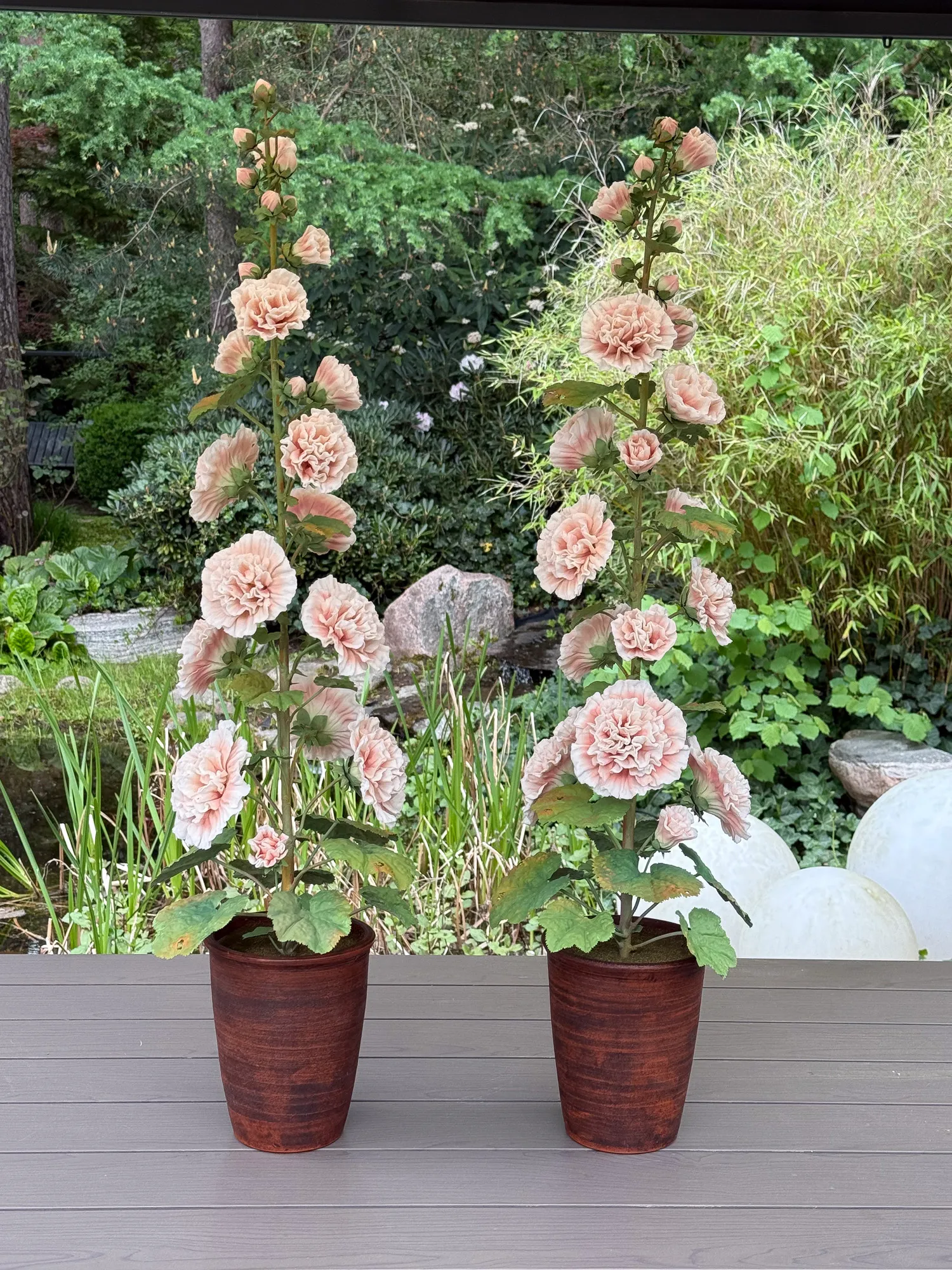 Hollyhock — botanical sculpture in porcelain and hand-painted copper by Faja Schroeder