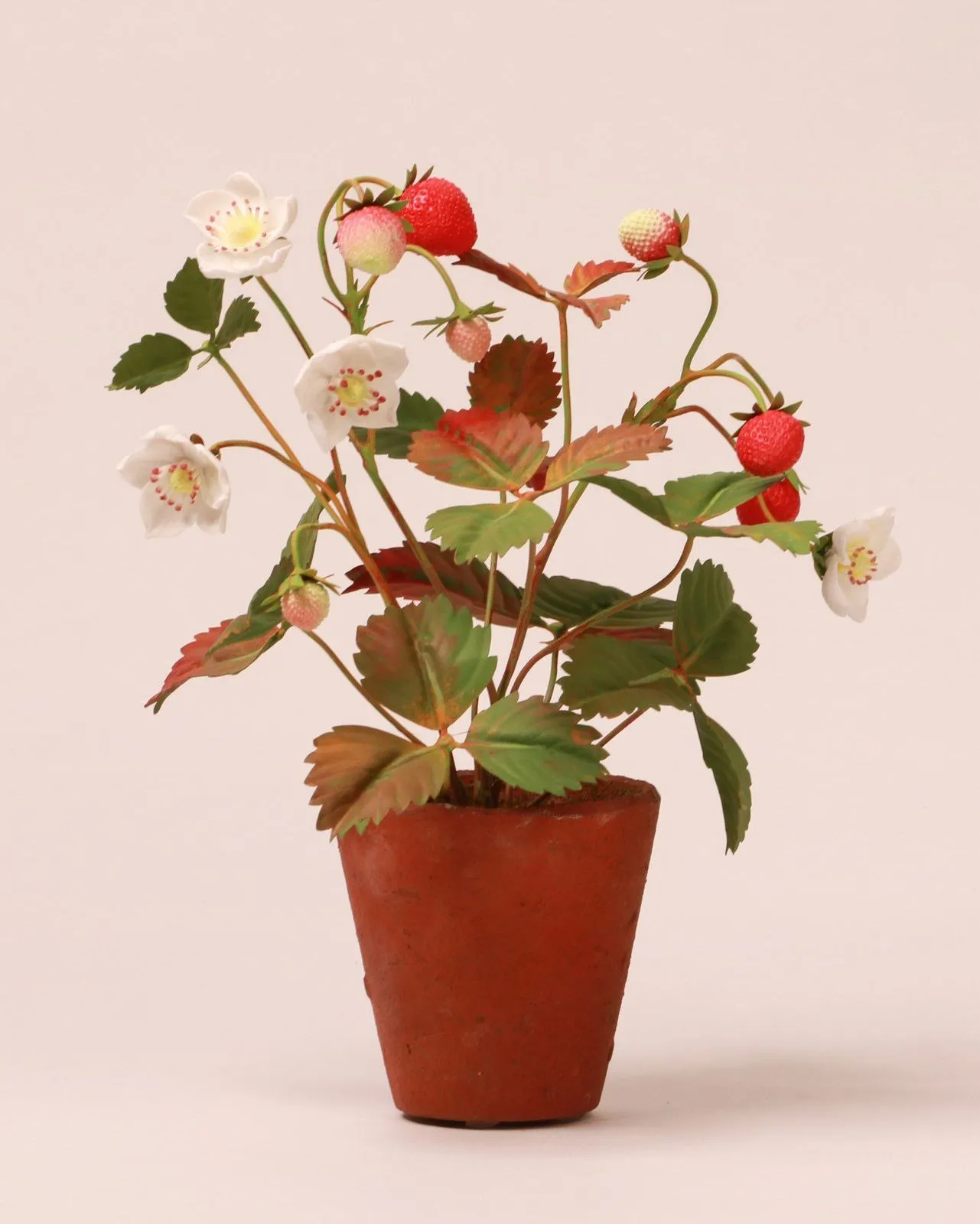 Strawberry — botanical sculpture in porcelain and hand-painted copper by Faja Schroeder